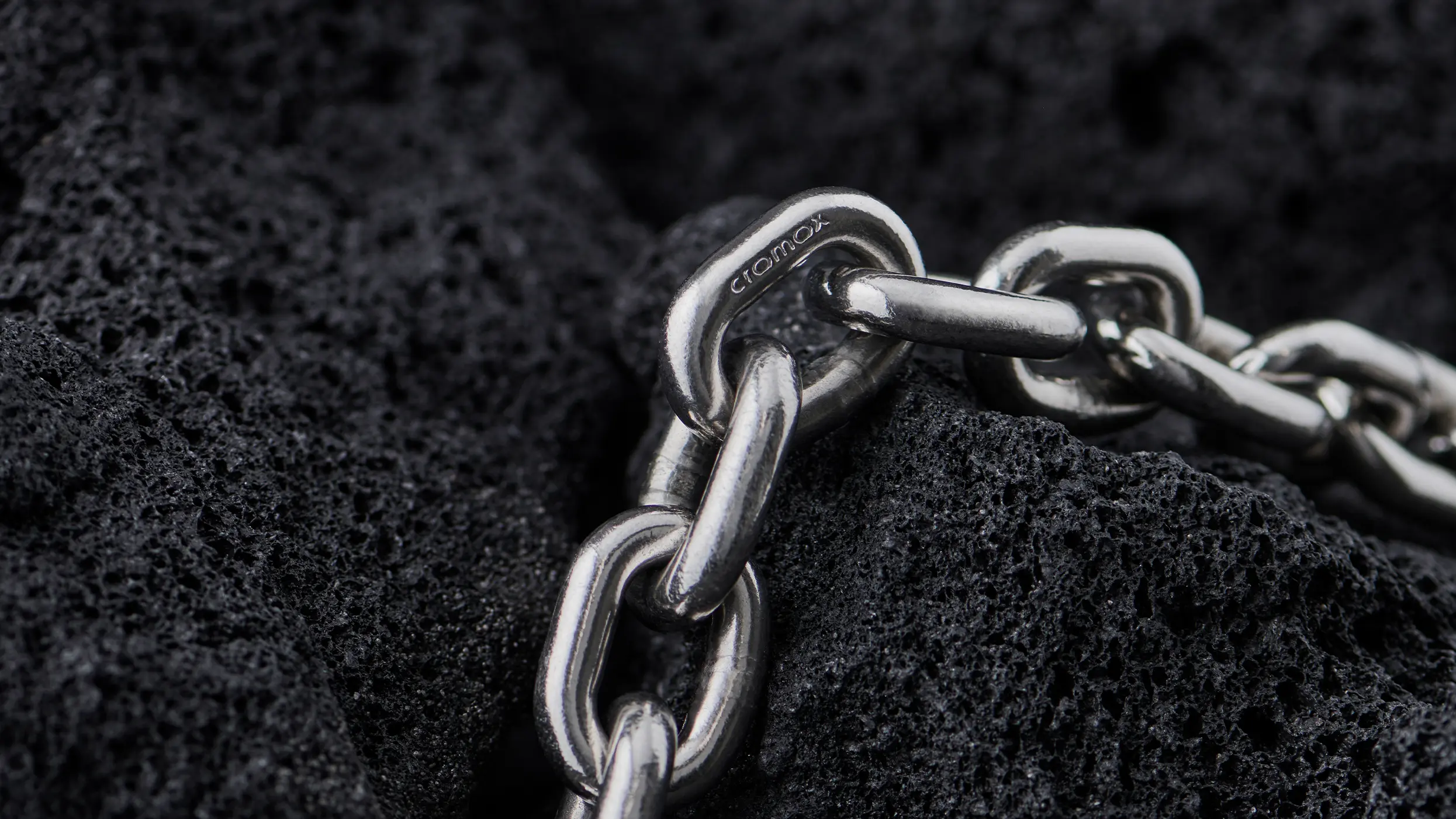 cromox® conveyor chain on black volcanic rock